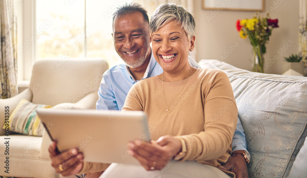 Tablet, video call and senior couple at home for communication, network connection or chat. Mature man and woman together with technology, social app and internet while laughing on a living room sofa Tablet, video call and senior couple at home for communication, network connection or chat. Mature man and woman together with technology, social app and internet while laughing on a living room sofa