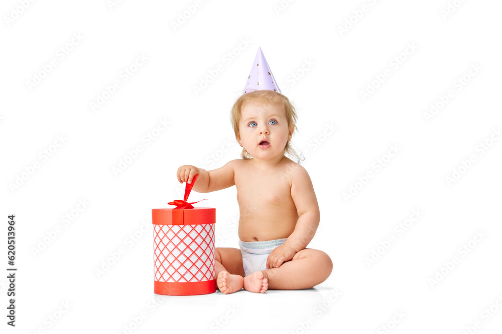 Happy birthday. Little baby girl, toddler in diaper celebrating birthday against white studio background. Presents Happy birthday. Little baby girl, toddler in diaper celebrating birthday against white studio background. Presents
