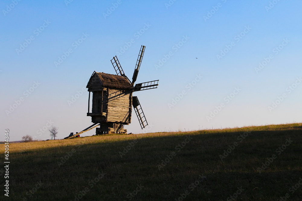 Fototapeta premium windmill at sunset