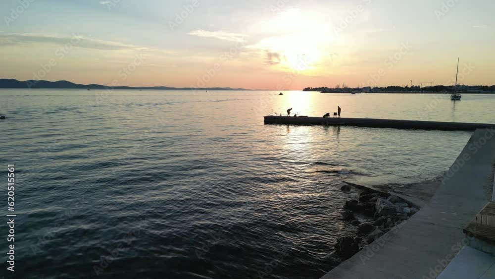 Zadar sunset a drone lift up over coastline in sunset. Croatia in summer