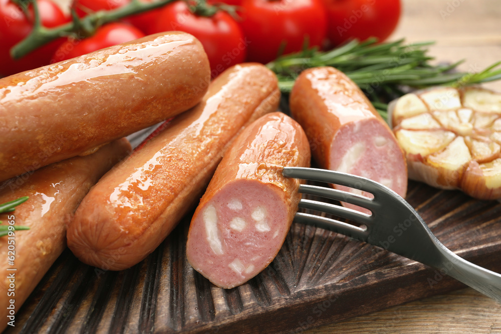 Delicious vegan sausages served on wooden table, closeup Delicious vegan sausages served on wooden table, closeup