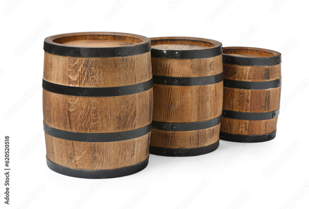 Three traditional wooden barrels on white background Three traditional wooden barrels on white background