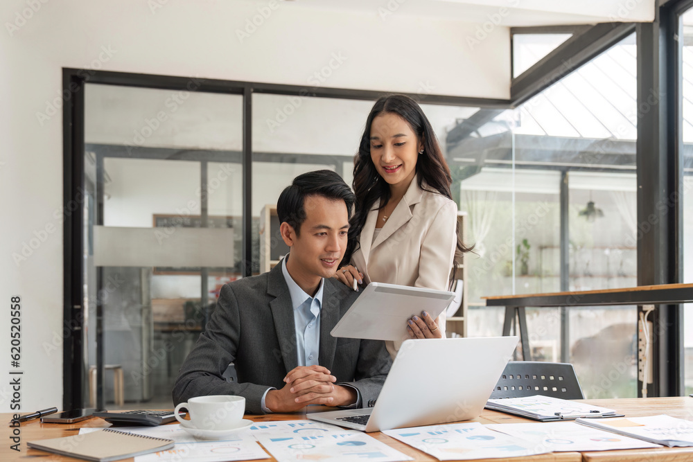 Business people working with new startup project idea presentation, analyze planning on tablet at office Business people working with new startup project idea presentation, analyze planning on tablet at office