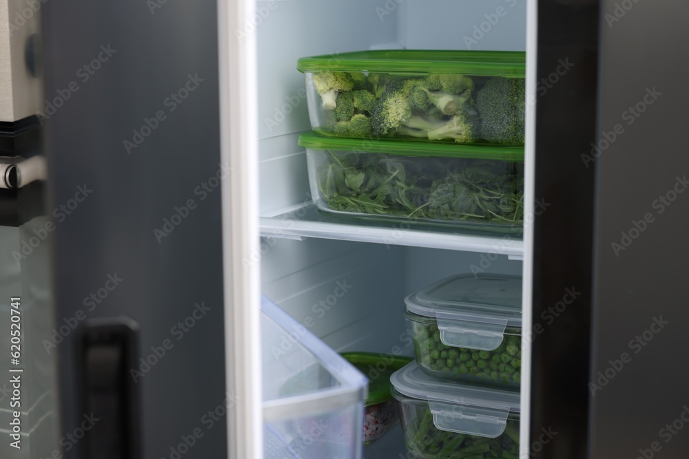 Glass containers with different fresh products in fridge. Food storage Glass containers with different fresh products in fridge. Food storage
