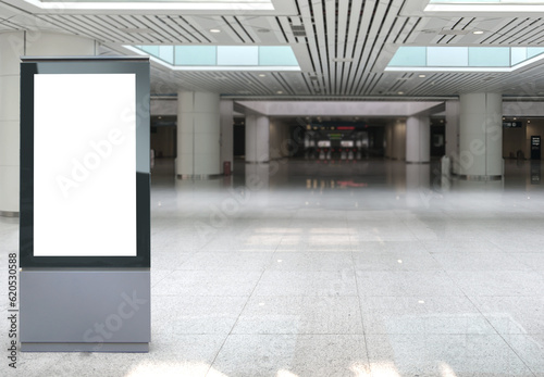 Beautiful blank advertising billboard at airport, train station. White panel for mockup. Copy space background, large LCD advertisement.