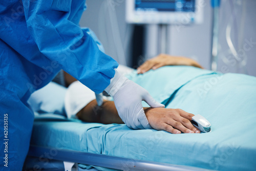 Obraz na płótnie Sick, hand and a doctor with a patient in surgery for pulse, holding hands or support in bed