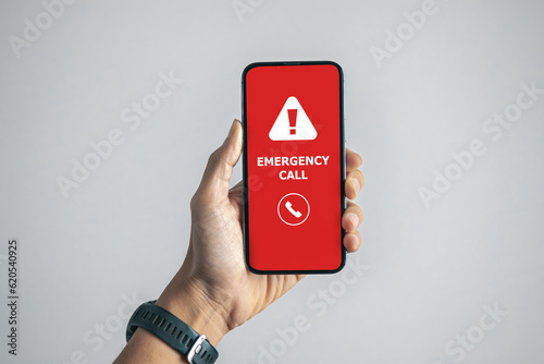 Emergency call and alert icon on red mobile screen for emergency accident hot line 911 concept.	