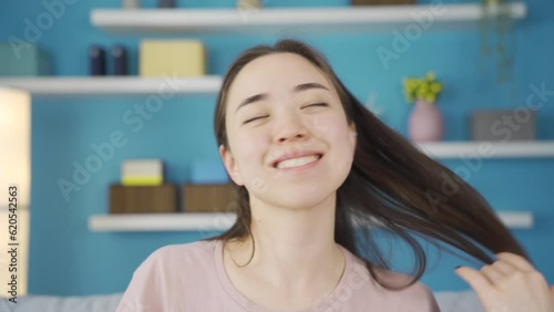 Close-up portrait of funny and beautiful Asian young woman.
