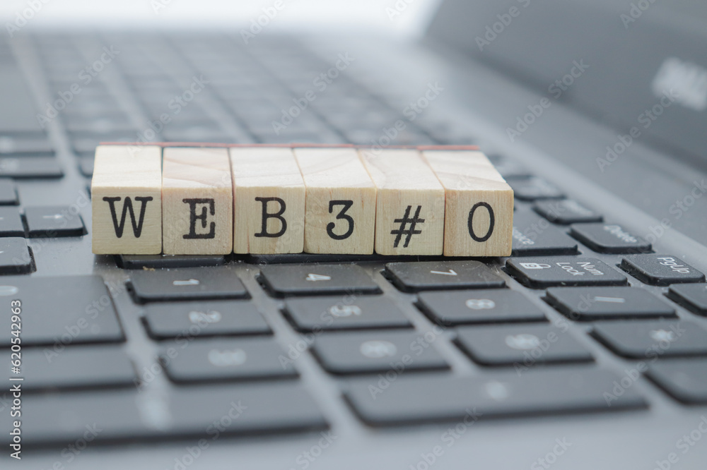 web 3.0 written on wooden cubes on a computer web 3.0 written on wooden cubes on a computer
