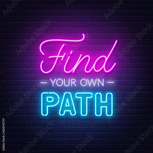 Find Your Own Path neon lettering on brick wall background.