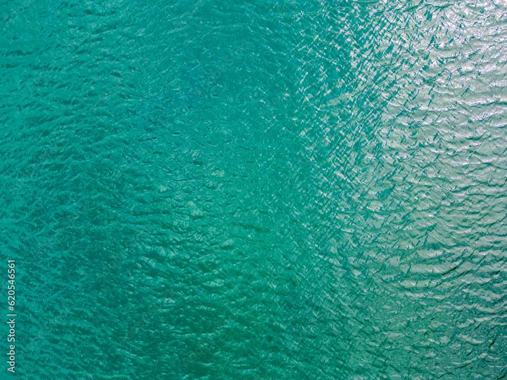 Aerial view of a crystal clear sea water texture. View from above ...