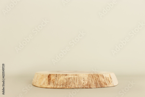 Wooden board over pastel color background. For cosmetics, aesthetics, and objects mockup