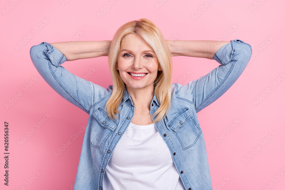 Photo of pretty senior lady raise arms hold behind head feel good resting vacation weekend relax job isolated pink color background Photo of pretty senior lady raise arms hold behind head feel good resting vacation weekend relax job isolated pink color background