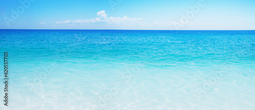 Idyllic sand beach, tranquil sea, and blue sky create a serene summer vacation destination. © mitarart