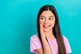 Portrait of cute young lady speak secret news announce big kids party birthday celebration look empty space isolated on blue background