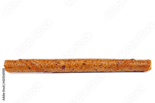 Fruit leather apricot roll isolated on a white background. Tasty fruit pastille marshmallow.