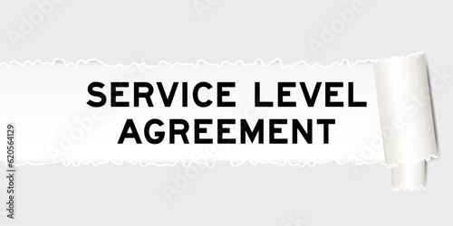Ripped gray paper background that have word service level agreement under torn part