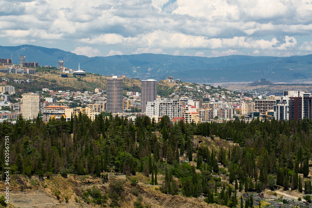 Saburtalo Vake district in Tbilisi, Georgia on a sunny summer day with beautiful clouds.	