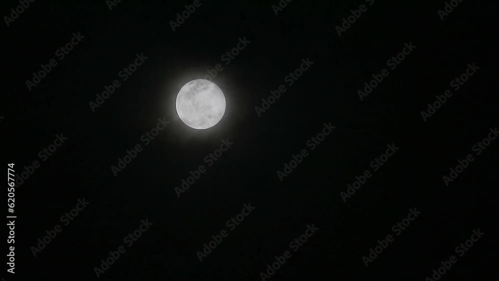 Flower moon shiny on the dark night sky back cloud with cloud passing Flower moon shiny on the dark night sky back cloud with cloud passing