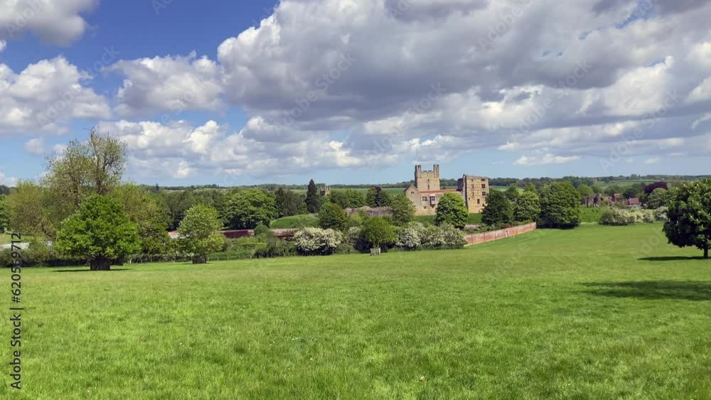 Scenic view of Helmsley Castle and Walled Garden with parkland in the foreground in the beautiful North York Moors. Taken on a sunny day in Spring - North Yorkshire, UK