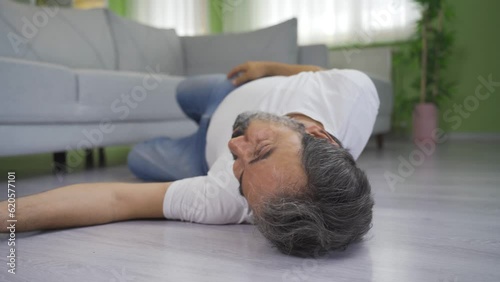 Elderly man having an epileptic attack at home.