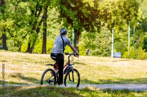 Cyclist ride on the bike path in the city Park