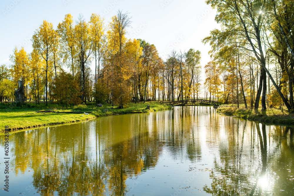 Colorful city park scene in the fall with orange and yellow foliage. Beautiful autumn scenery Lithuania. Colorful city park scene in the fall with orange and yellow foliage. Beautiful autumn scenery Lithuania.