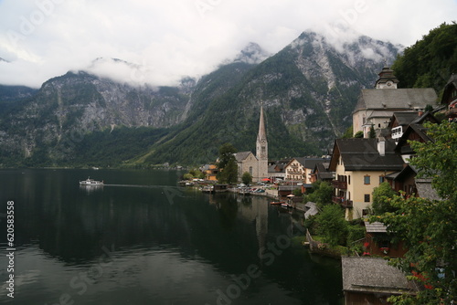 A view of a town with a lake and mountains in the background, Austria