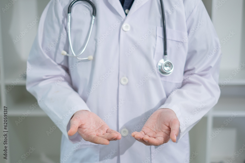 Doctor's empty hand is giving, receiving or offering. Concept of hospital charity advertisement, marketing or commercial. Concept of organ donation. Doctor uniform background or wallpaper. Doctor's empty hand is giving, receiving or offering. Concept of hospital charity advertisement, marketing or commercial. Concept of organ donation. Doctor uniform background or wallpaper.
