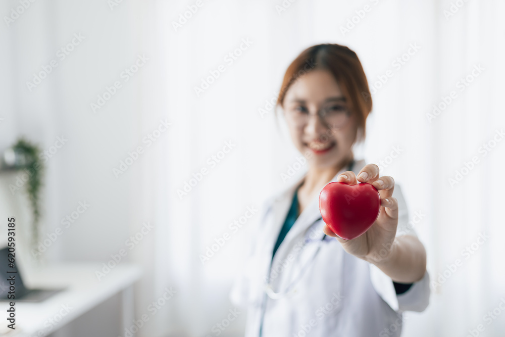 Portrait of female doctor and care concept for heart patients. Portrait of female doctor and care concept for heart patients.