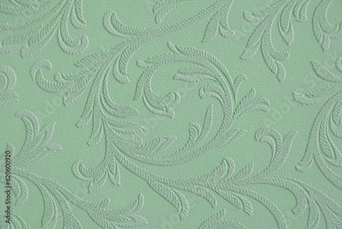 Beautiful wallpaper texture. Good pattern. Pistachio background for design. Close-up. Selective focus.