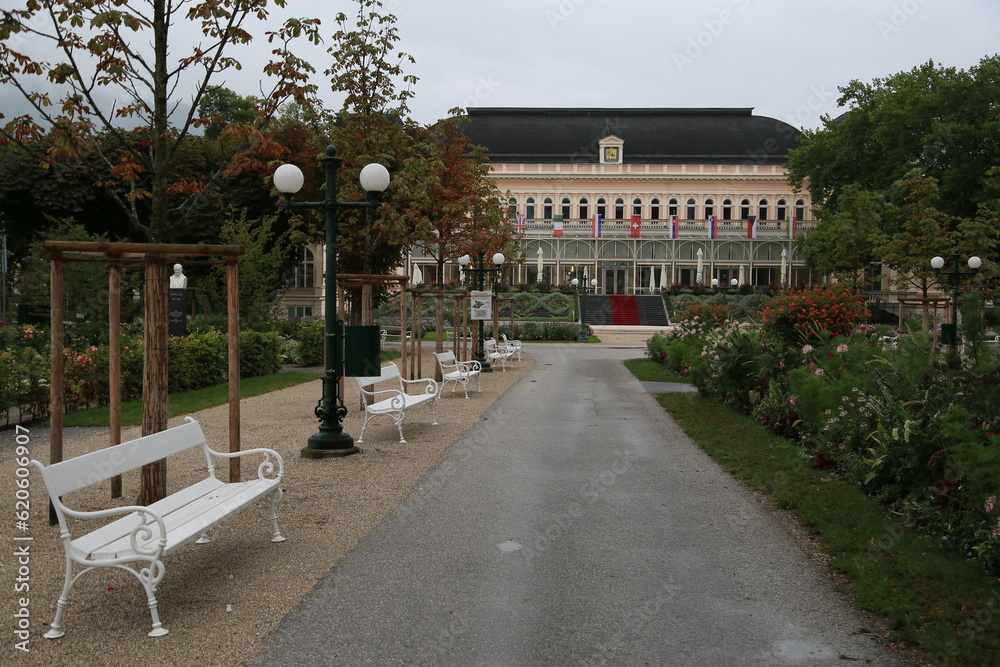 Photo of a grand building with a lush garden in the foreground, Austria Photo of a grand building with a lush garden in the foreground, Austria