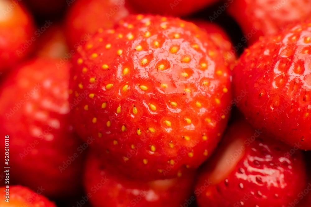 Wild strawberries in a pile. Juicy strawberries picked by hand Wild strawberries in a pile. Juicy strawberries picked by hand