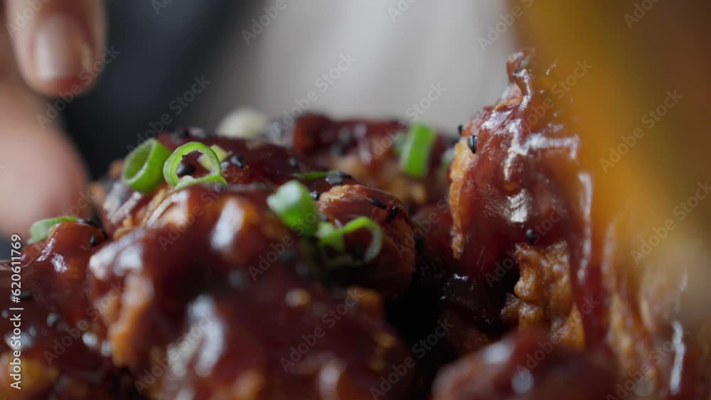 Girl eating chicken wings, high calorie food and health risks