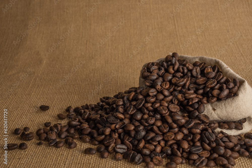 Roasted coffee beans on hemp background. Roasted coffee beans on hemp background.
