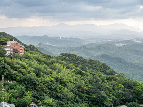 Landscape view of Jioufen (jiufen) village, mountain and sea view for viewpoint near Tea house in Taiwan. This village inpired the Ghibli animation 'Spirited Away'.  photo