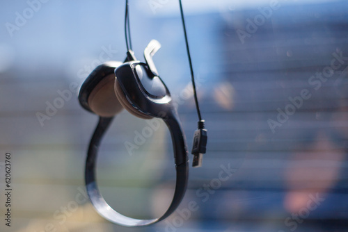 The headset of a customer support employee, left behind after artificial intelligence takes over his job 