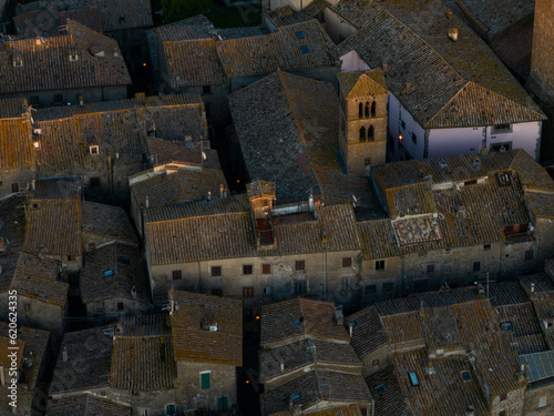 Obraz na płótnie View from above, close-up view of the village of Vitorchiano at sunset. Vitorchiano is a medieval Italian village in Viterbo Province, Lazio, Italy.. w salonie