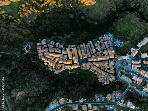 Obraz na płótnie View from above, stunning aerial view of the village of Vitorchiano at sunset. Vitorchiano is a medieval Italian village in Viterbo Province, Lazio, Italy.. w salonie