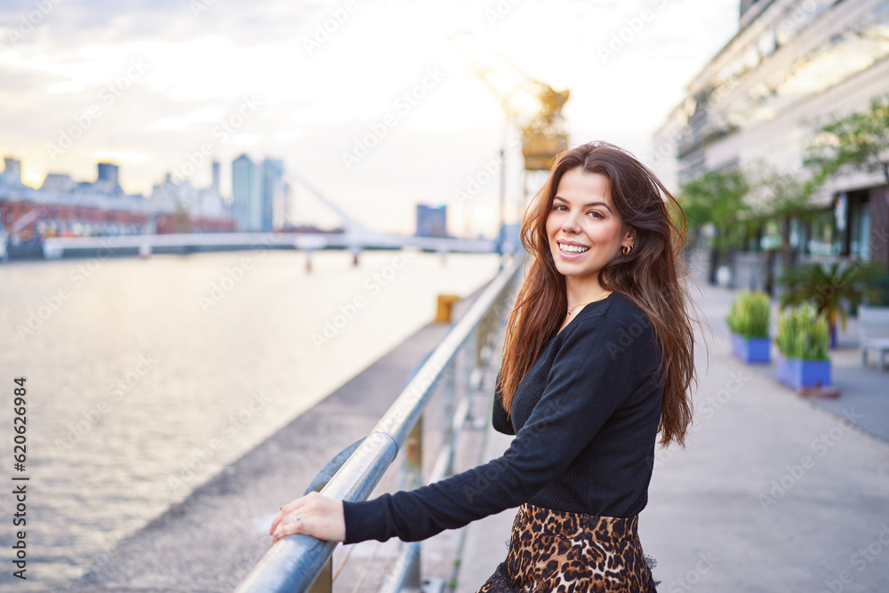 Fototapeta premium portrait beautiful latin american woman looking and smiling happy in exterior of Puerto Madero