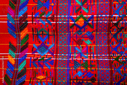 Colorful textile for sale in public space in Guatemala City, work done by indigenous hands of millenary Mayan culture, handicraft work economy in Latin America. photo
