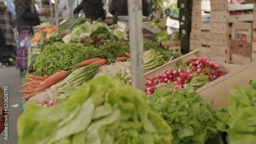 crates with fresh vegetables and fruits at market in Paris