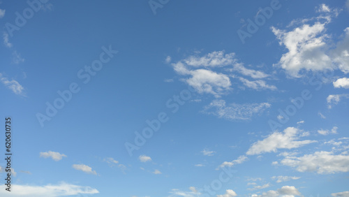 A bright sky with white clouds with blue sky background.