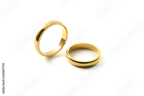 Engagement gold rings standing and lying down white isolated background