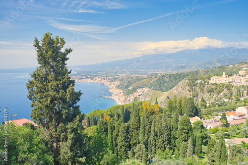 View from Taormina on Giardini Naxos Bay  with Etna volcano in the background in Sicily  Italy