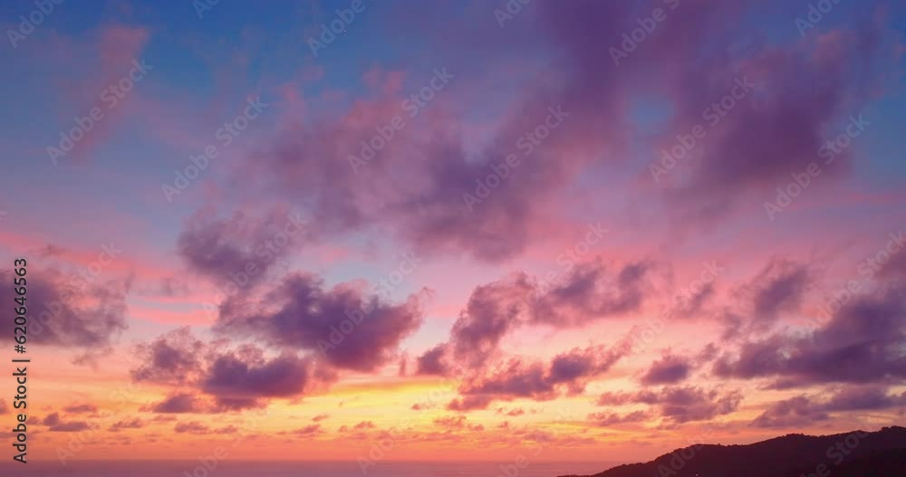 aerial view Majestic sunset or sunrise landscape Amazing light of nature above Patong beach..stunning cloud scape colorful sky and clouds moving away rolling. .4k colorful clouds above the ocean. aerial view Majestic sunset or sunrise landscape Amazing light of nature above Patong beach..stunning cloud scape colorful sky and clouds moving away rolling. .4k colorful clouds above the ocean.