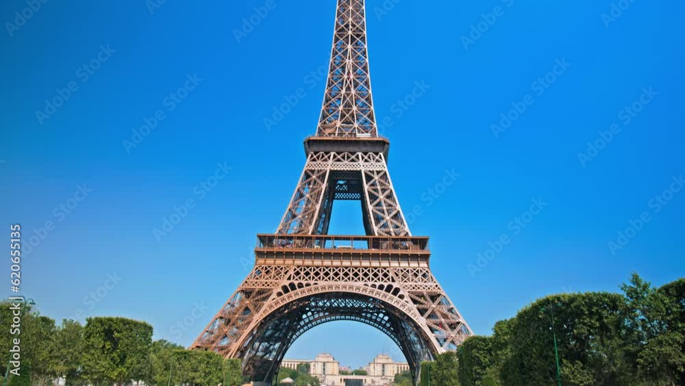 View of the Tower's detailed wrought-iron structure as the camera moves from the base of the tower to the observation deck at the top. Historical landmark of the World famous symbol of Paris, France. 