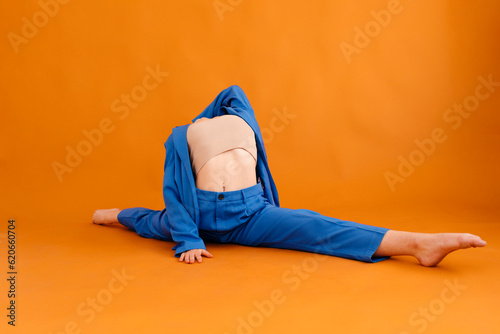 Flexible woman practicing front split photo