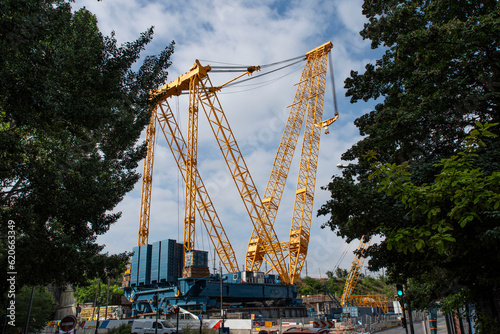 Giant crane on an urban construction site