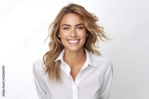 Portrait of beautiful young woman with blond hair and white shirt. photo
